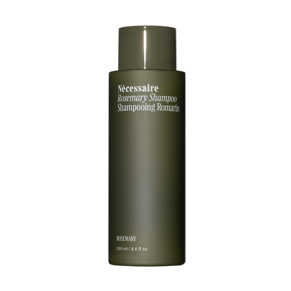 Nécessaire Rosemary Shampoo bottle pouring, depicting a gentle daily cleanse for stronger, resilient hair.