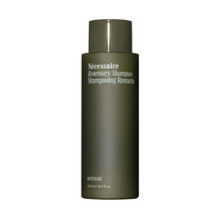 Nécessaire Rosemary Shampoo bottle pouring, depicting a gentle daily cleanse for stronger, resilient hair.