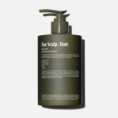 Nécessaire Rosemary Shampoo pump-action close-up showing easy daily use.