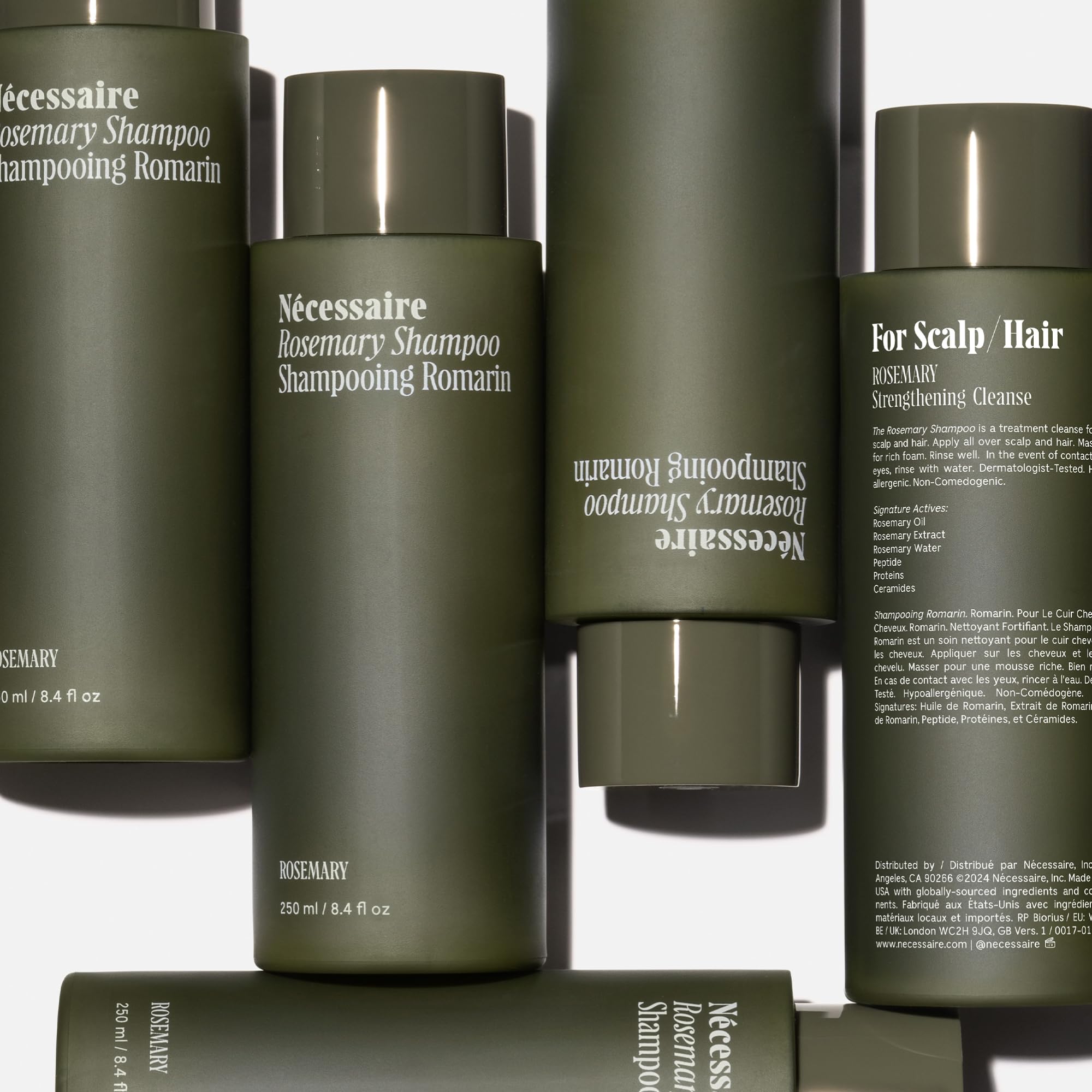 Nécessaire Rosemary Shampoo rosemary oil visual, evoking scalp-refreshing, aromatic ritual.