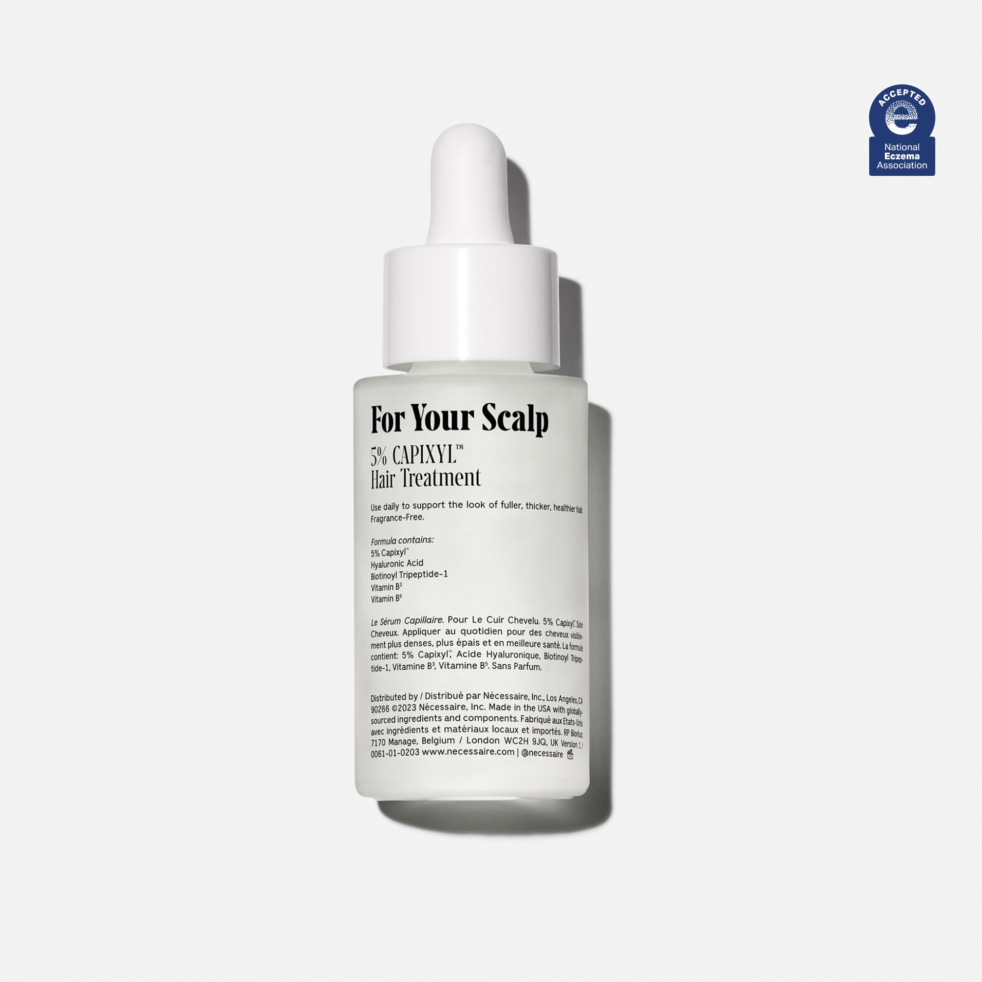 Nécessaire Scalp Serum pipette application demonstrates precise daily use on the scalp