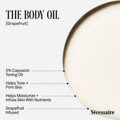 Nécessaire The Body Oil grapefruit ingredient close-up emphasizes refreshing citrus aroma.