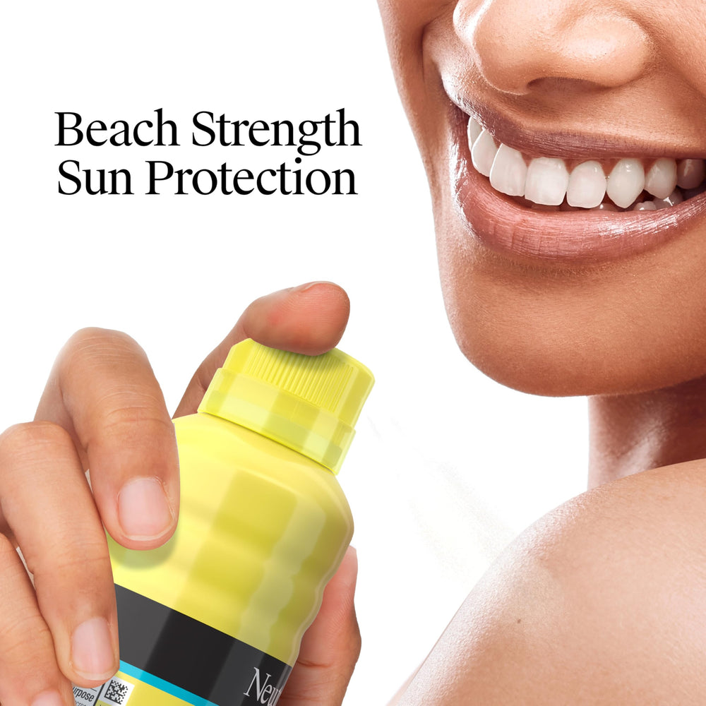 Neutrogena Beach Defense Spray bottle demonstrates lightweight, non-greasy texture for outdoor use.