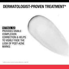 Fingertip application of Neutrogena Stubborn Marks PM Treatment before bedtime.
