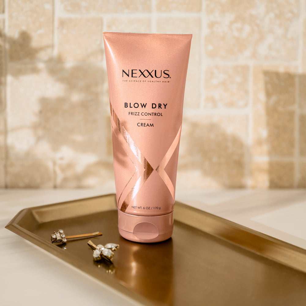 Nexxus Blow Dry Cream texture swatch showing silky, light-weight feel