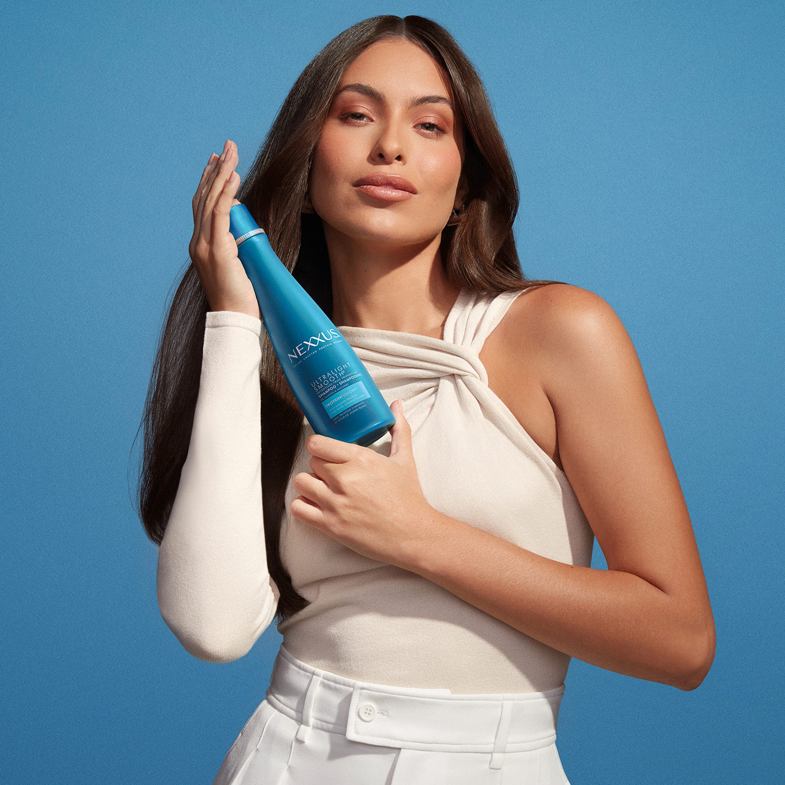 NEXXUS Ultralight Smooth Frizz Defy Serum dispense indicates multi-step routine benefits.