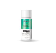 NIOXIN front bottle showing product identity and compact travel-friendly design