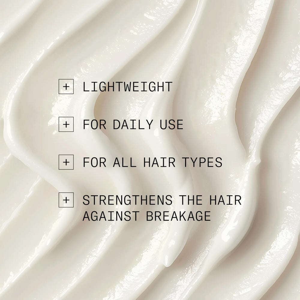 NIOXIN bottle on bath shelf conveying an organized, daily-care routine