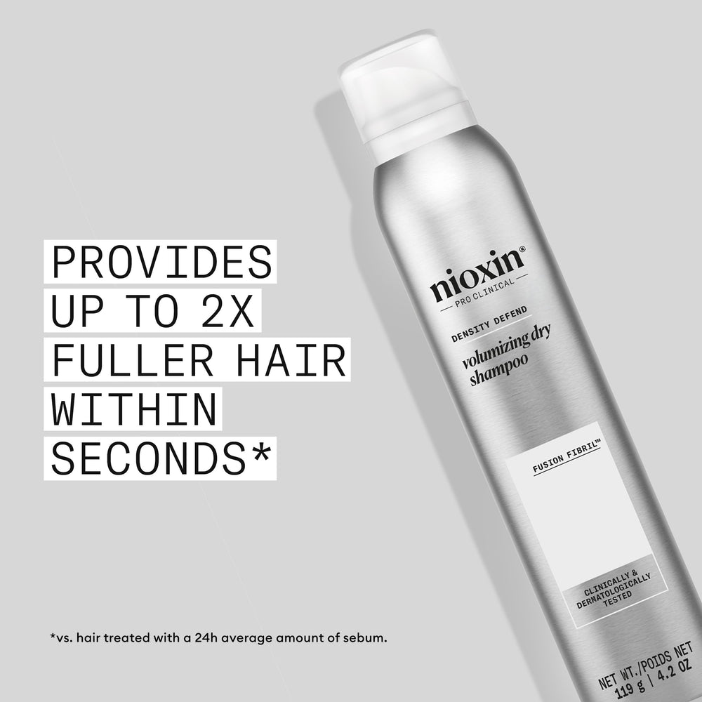 Nioxin spray nozzle close-up for precise root application