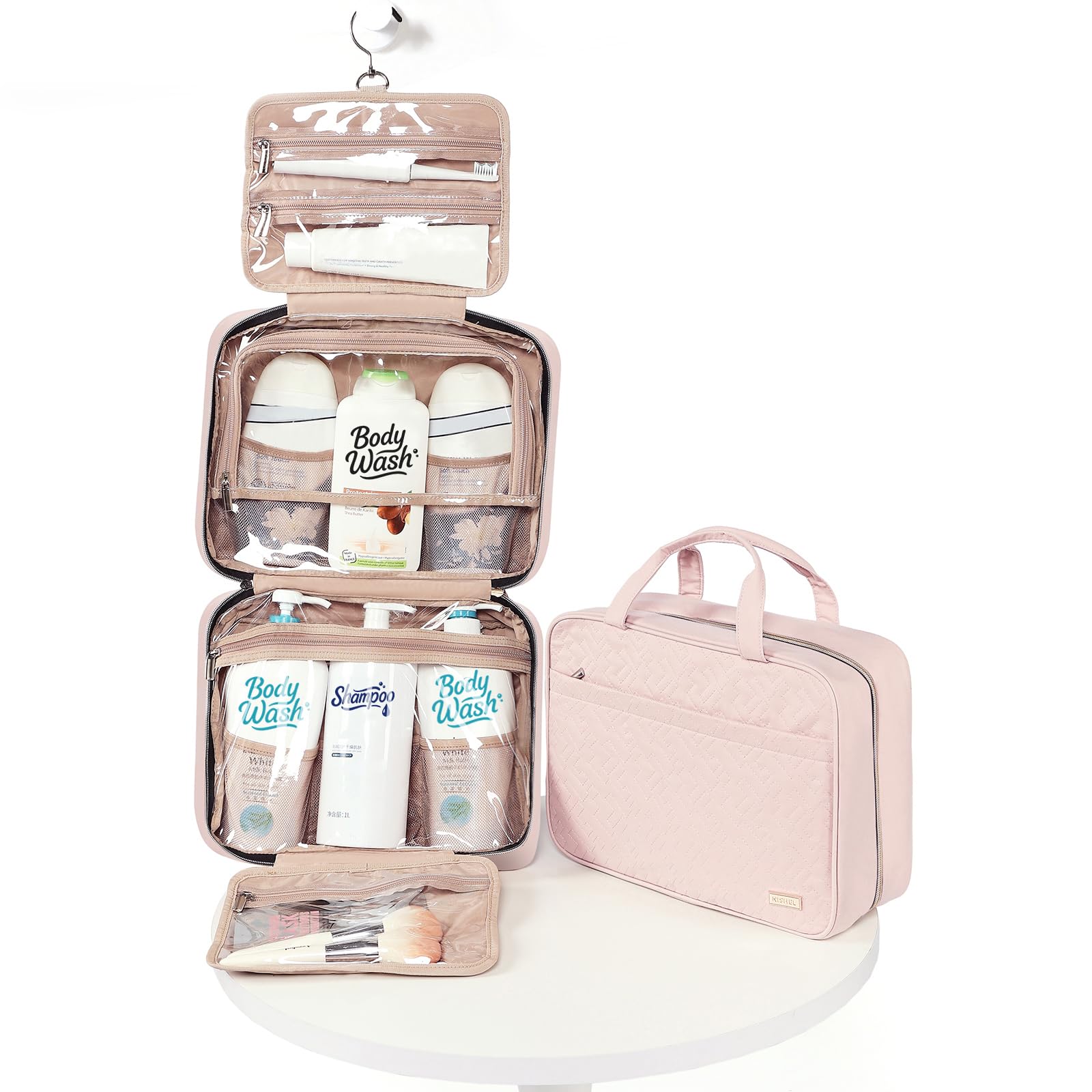 NISHEL travel toiletry bag pink shows elastic pockets for skincare and brushes.