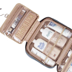 NISHEL bag reveals four compartments for organized cosmetics