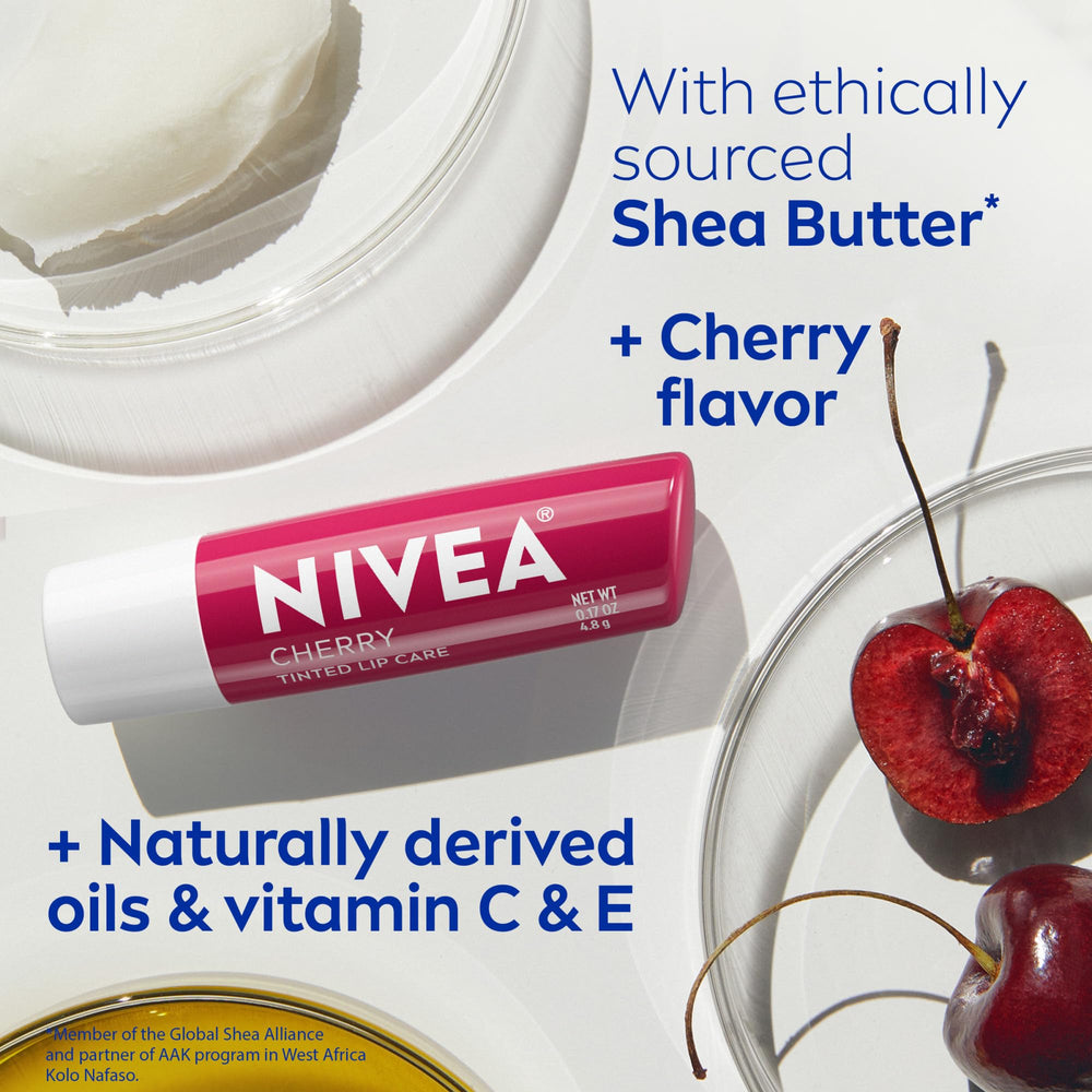 NIVEA Cherry Lip Care four-pack shown on bathroom counter and bag.