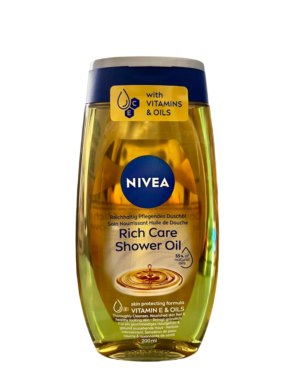 NIVEA Shower Oil bottle pouring, delivering silky nourishment and a warm fragrance.