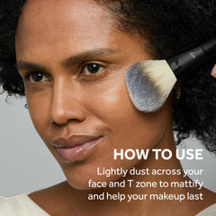No7 being applied with a fluffy brush to control shine and set makeup