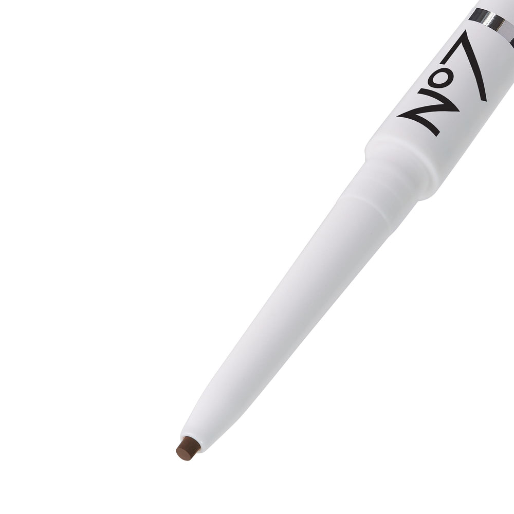 No7 pencil swatch on skin showing buildable light brown color