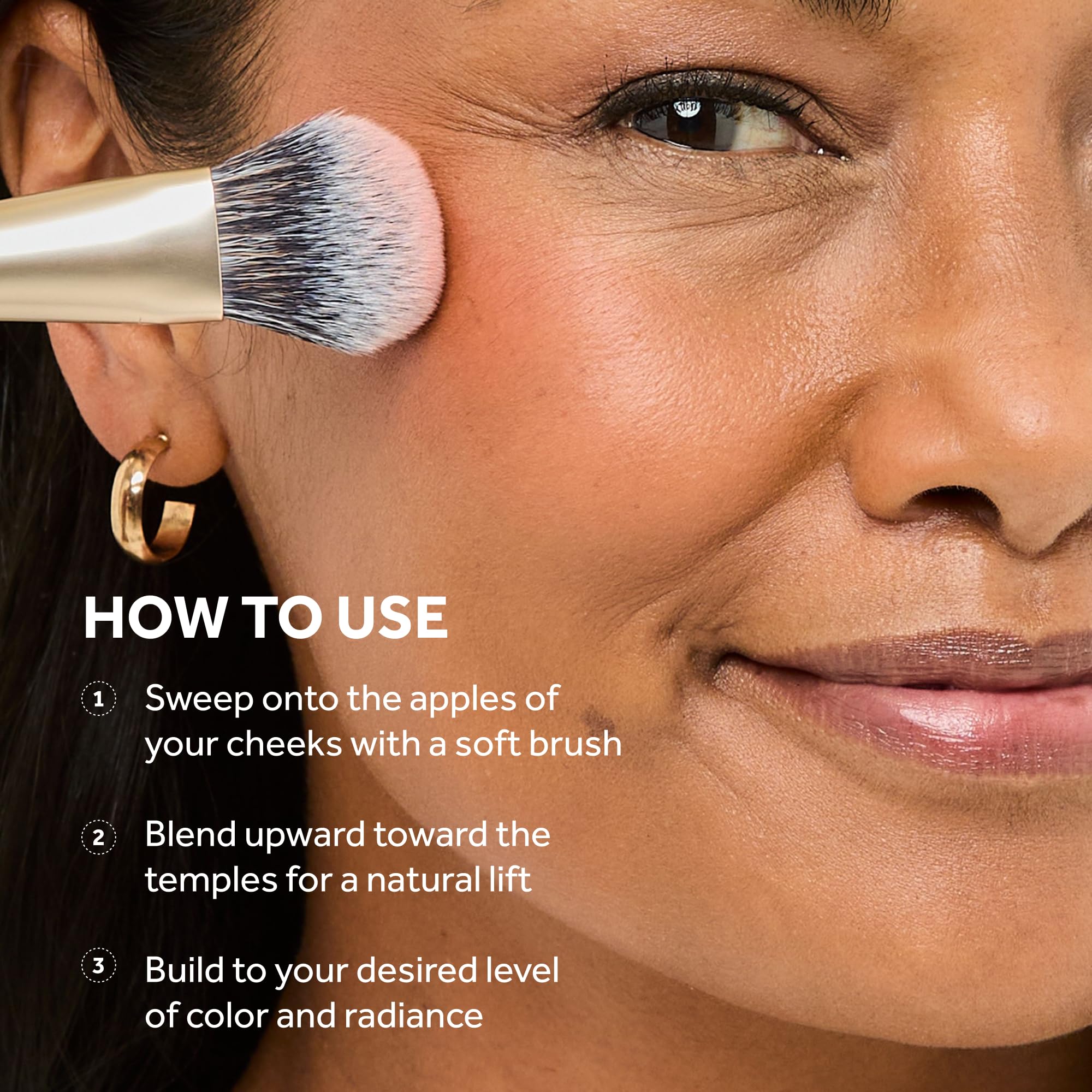 No7 applying Coral blush with brush on cheek demonstrating buildable color