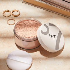No7 Flawless Finish Loose Powder on-skin closeup demonstrating matte, smooth skin.