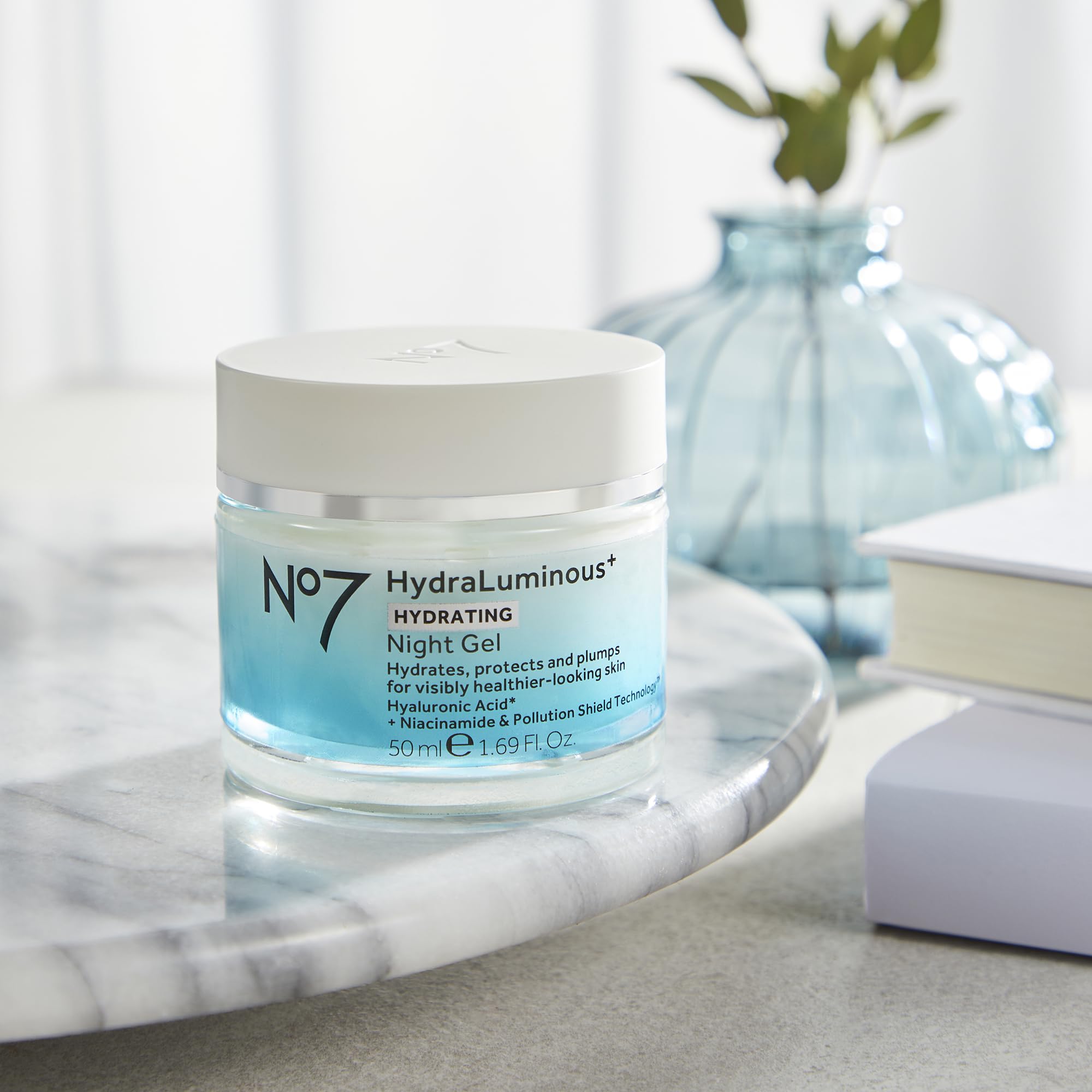 No7 product beside a ruler showing 1.69 fl oz size for scale