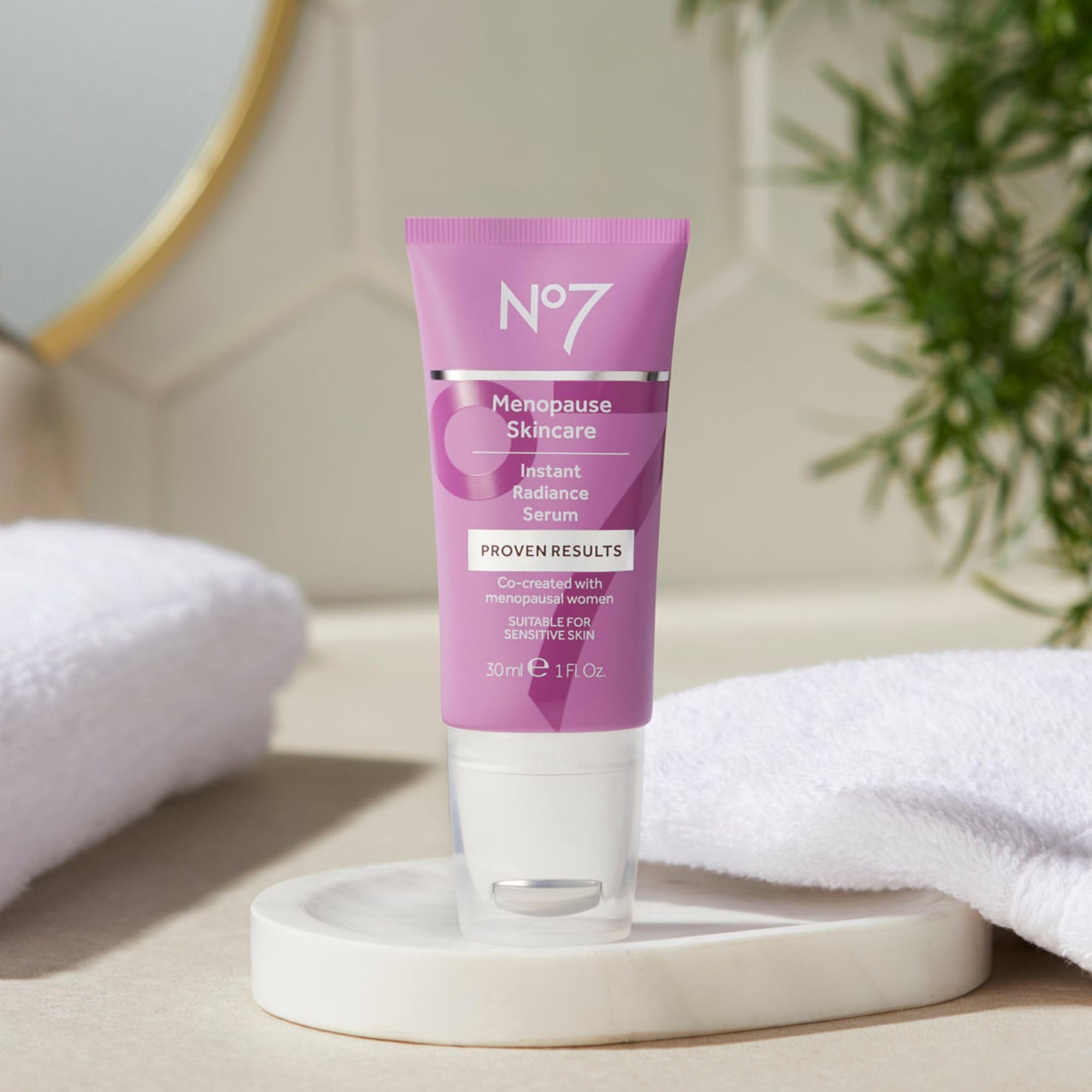 No7 Instant Radiance Serum applied to face and neck supports even hydration.