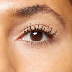 Model applying No7 mascara highlighting lifted lashes and false-lash effect