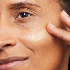 No7 Lift and Luminate Primer on skin showing luminous glow and even texture