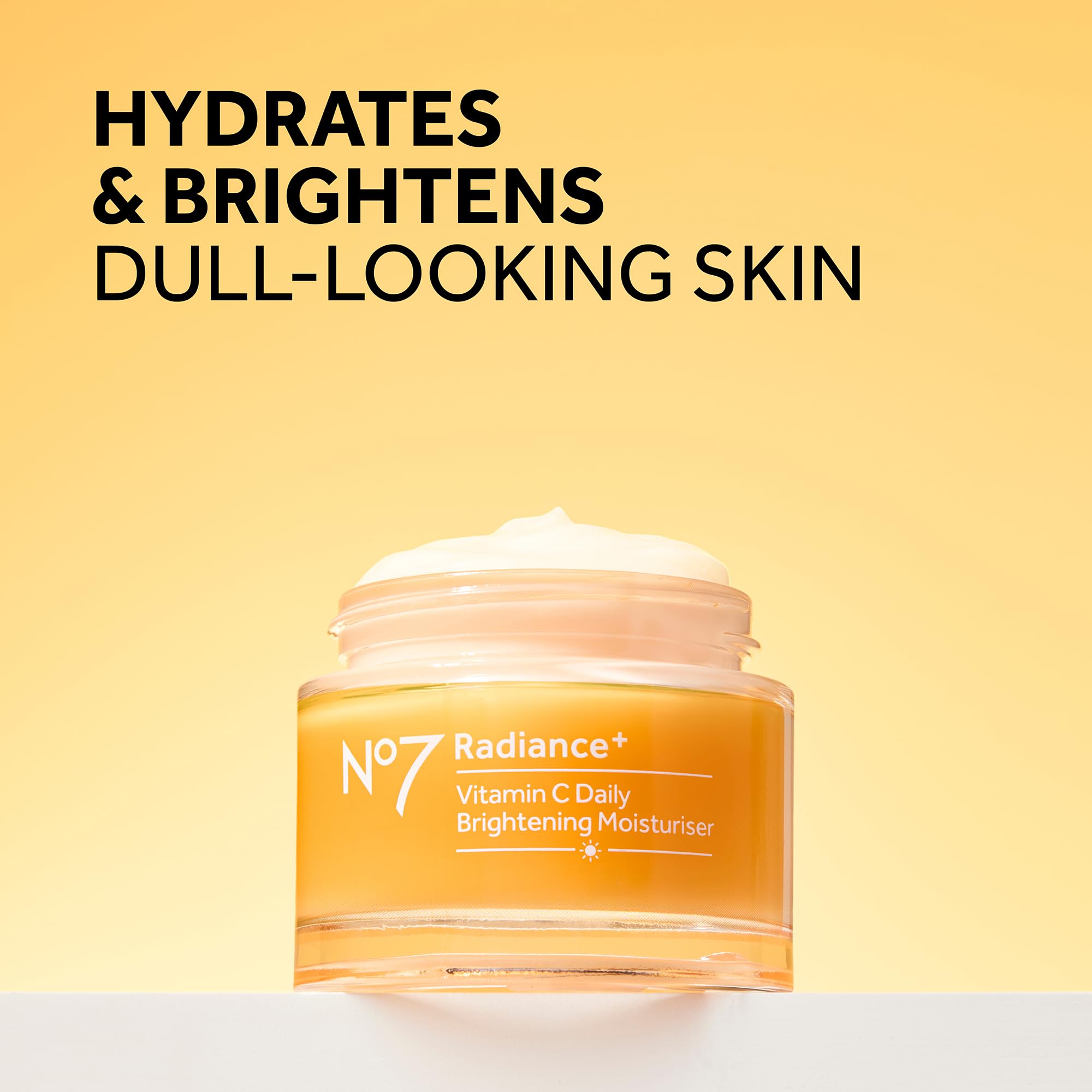 No7 Radiance vitamin C cream swirl on skin illustrating instant glow and absorption.