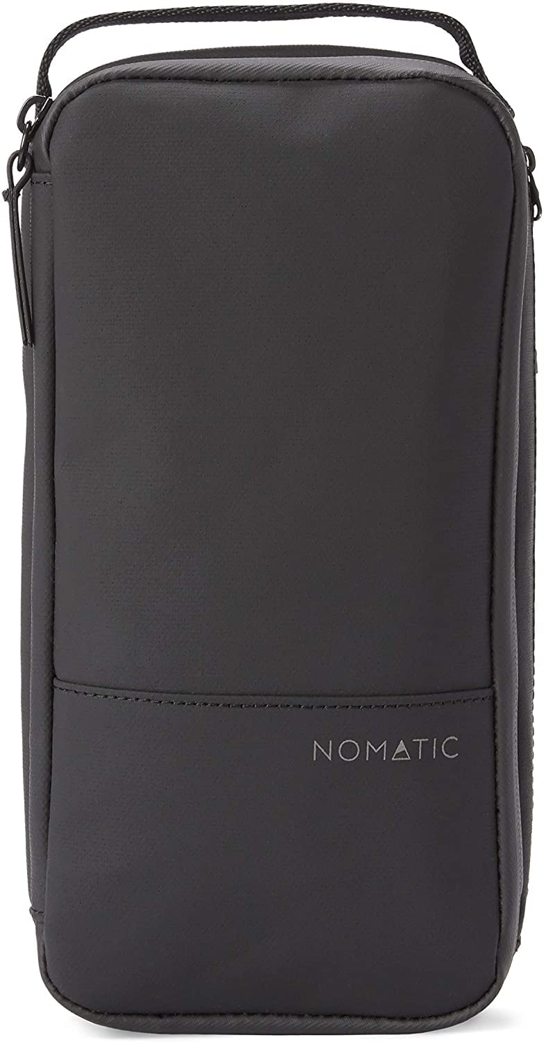 NOMATIC toiletry bag open compartments showcases organized sections for brushes and tubes.