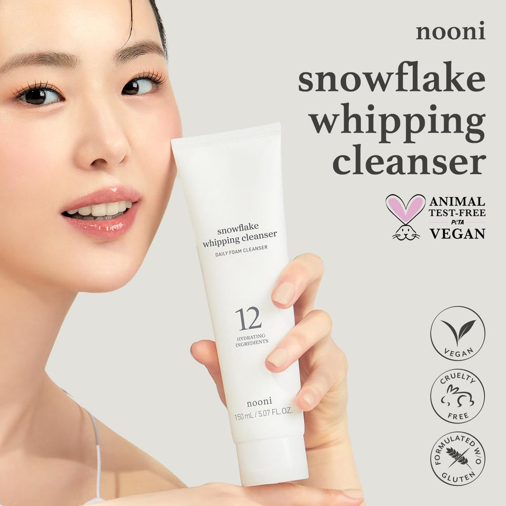 NOONI Snowflake Whipping Cleanser bottle pouring a light, fluffy foam.