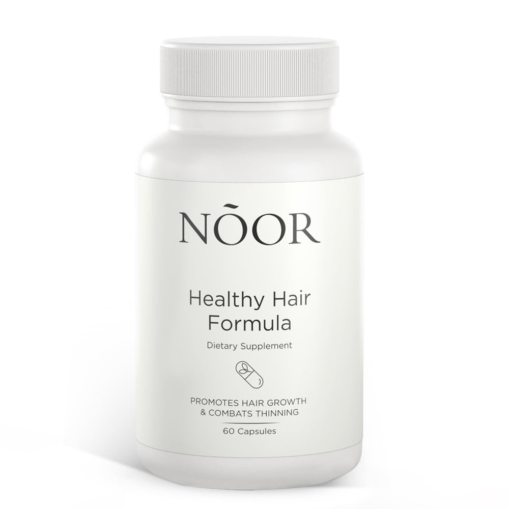 NOOR HAIR Healthy Hair Formula bottle on a clean surface for daily growth support