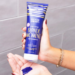 Not Your Mother's Blonde Moment Purple Conditioner bottle for hydrating repair.