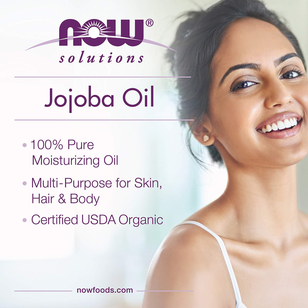 NOW Solutions Organic Jojoba Oil bottle closeup; pure, hexane-free formula.