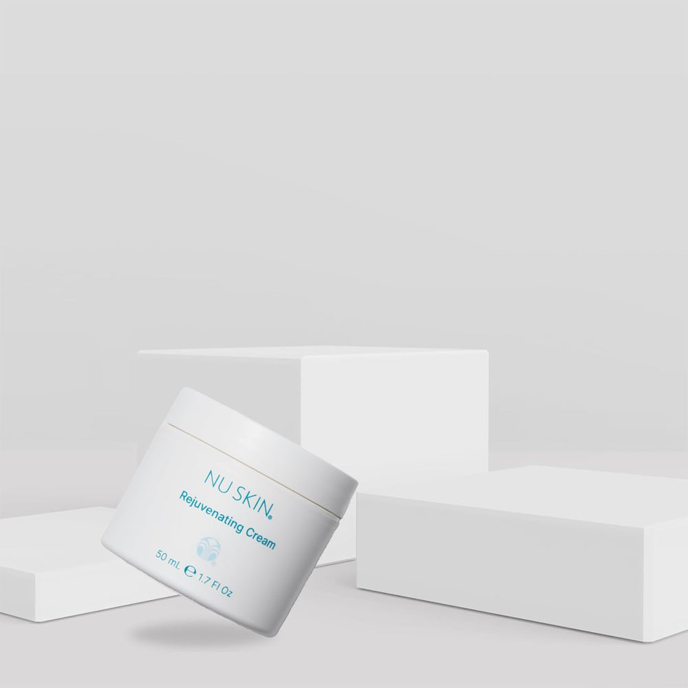 Nu Skin Rejuvenating Cream texture closeup highlights silky, quick-absorbing finish.