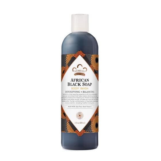 Nubian Heritage African Black Soap close-up texture shows herbal ingredients and lather potential.