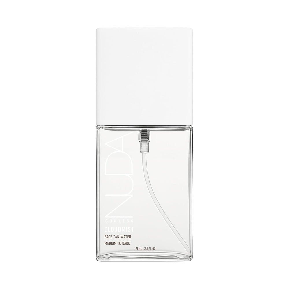 Nuda CloudMist bottle close-up showing lightweight clear self-tanner for a natural glow