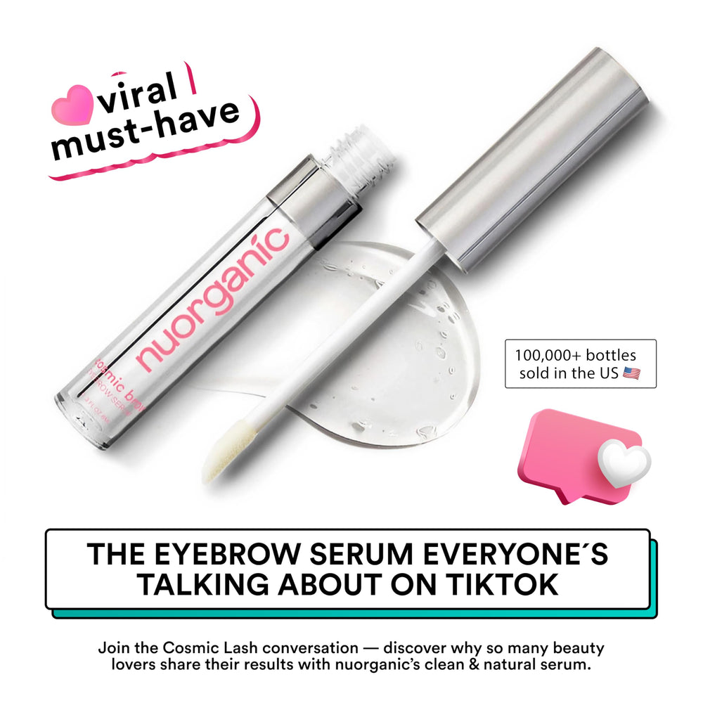 NuOrganic Cosmetics Cosmic Brow applicator brush applying serum for precise brow shaping.