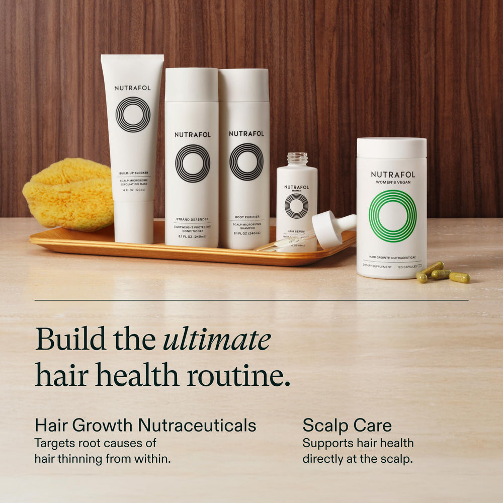 Nutrafol bottle on a bathroom shelf styled with towels, brand showing practical lifestyle fit