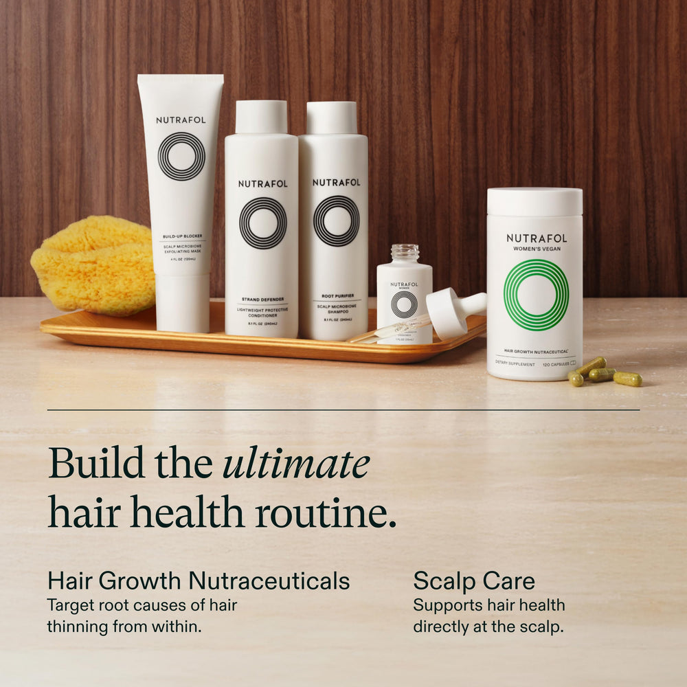 Nutrafol lifestyle woman at mirror applying product showing everyday routine confidence