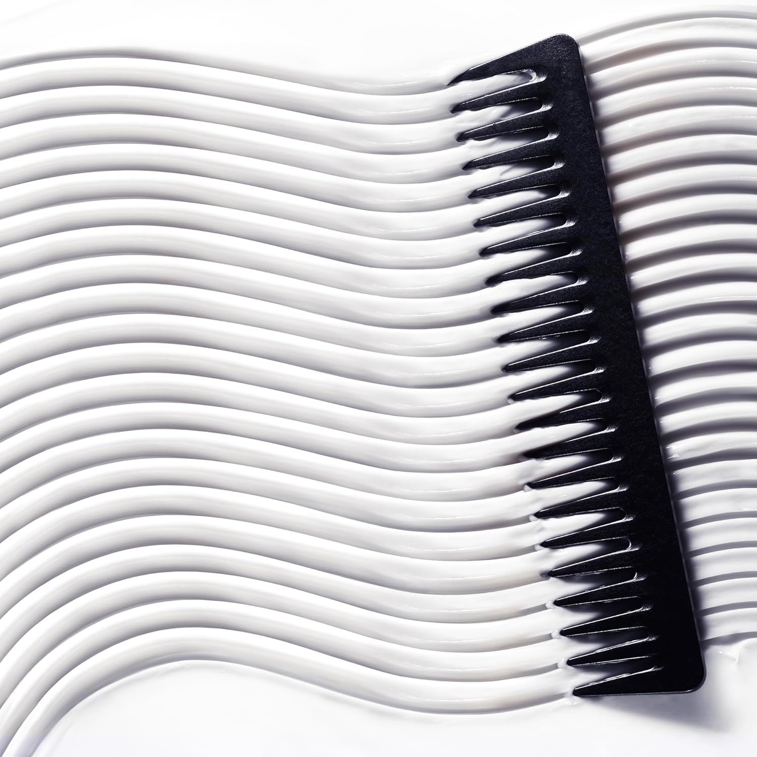 NUXE Silky hair after use shot demonstrates soft, shiny results