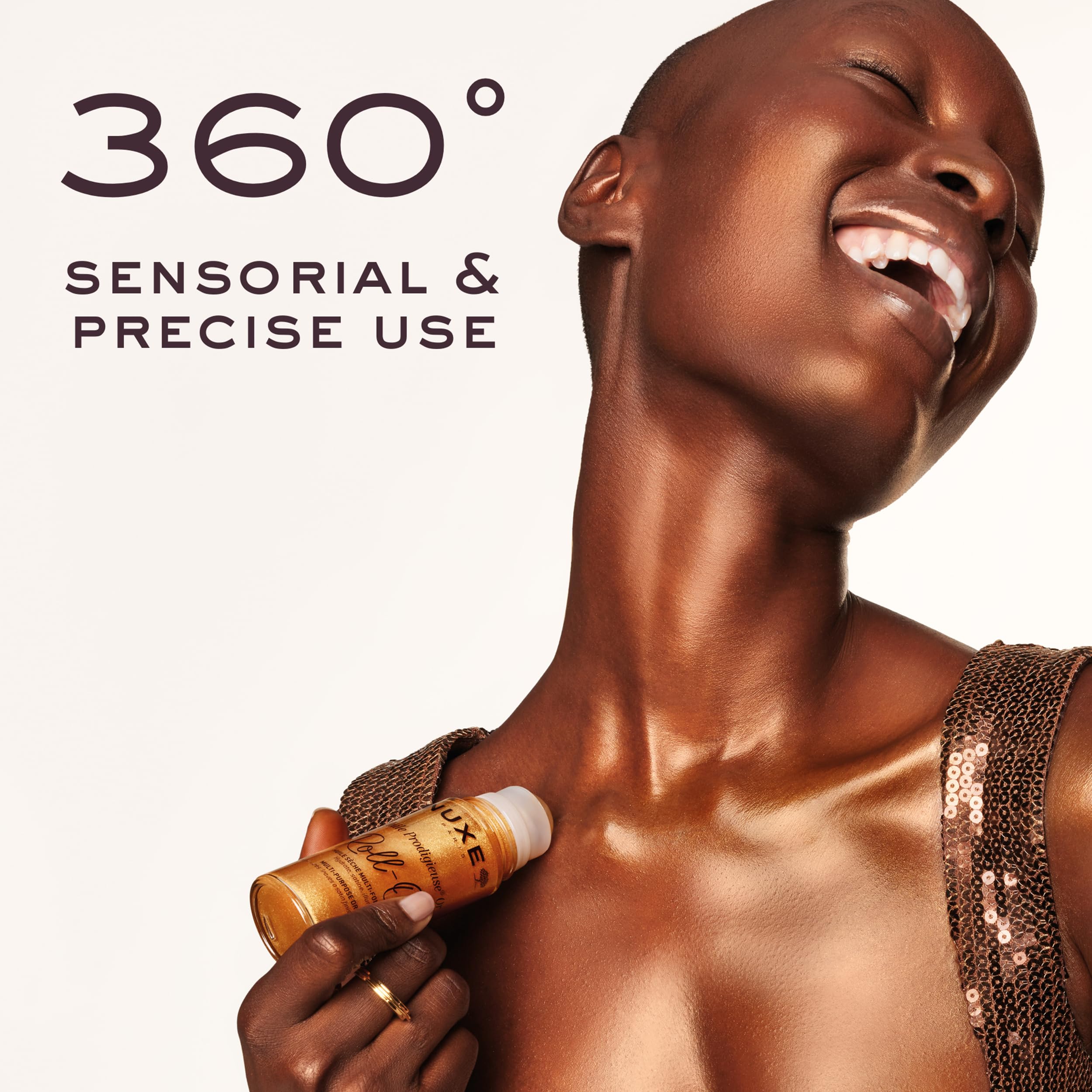 Nuxe Huile Prodigieuse Shimmer Roll-On applying point shows targeted radiance on skin.