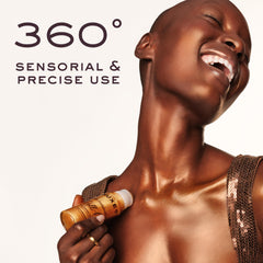 Nuxe Huile Prodigieuse Shimmer Roll-On applying point shows targeted radiance on skin.