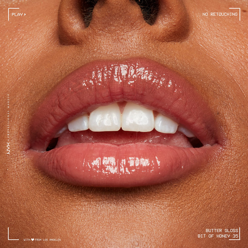 NYX Butter Gloss Bit Of Honey peach-nude shade complements daily looks.