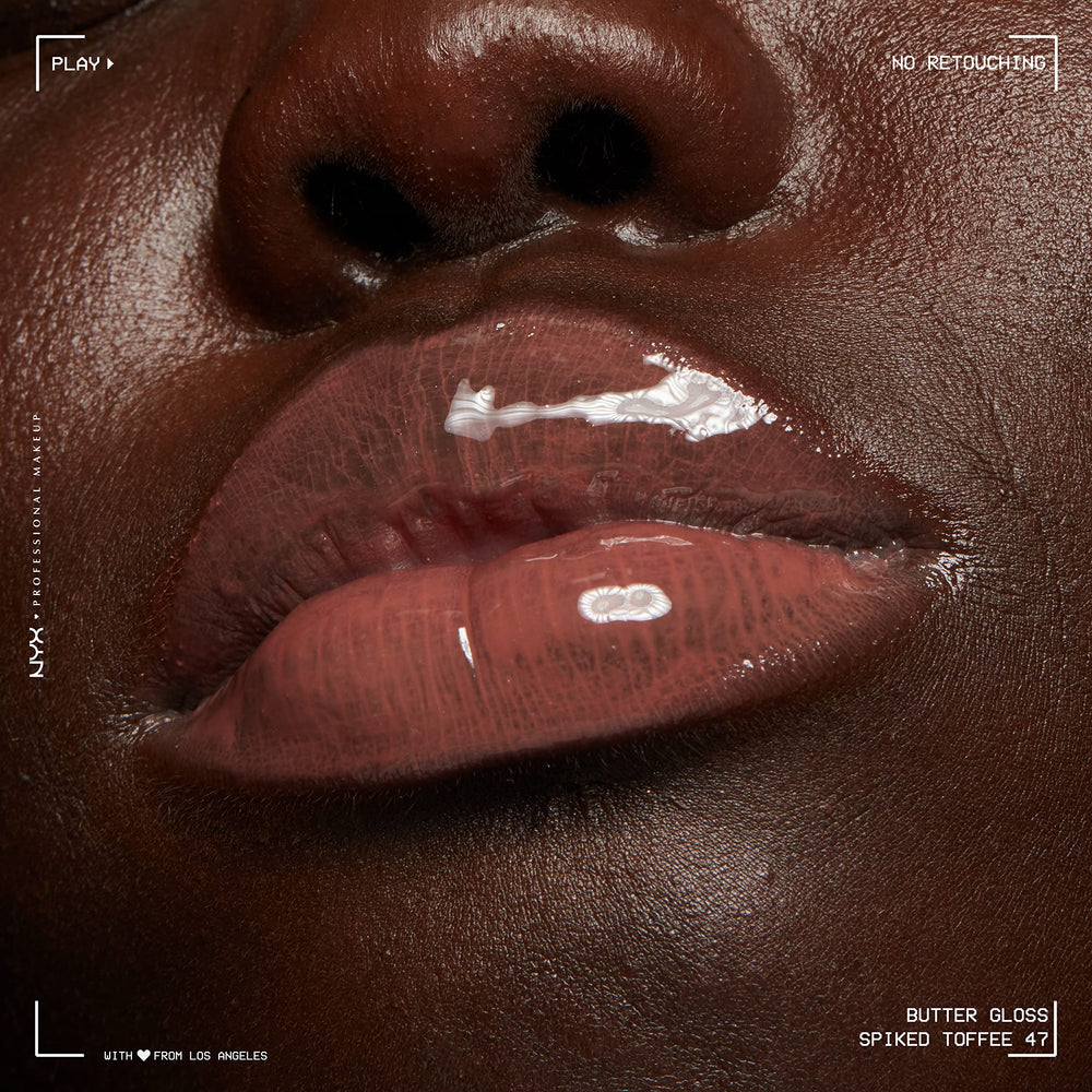 NYX Butter Gloss Spiked Toffee shade swatch demonstrates versatile sheer to medium coverage.