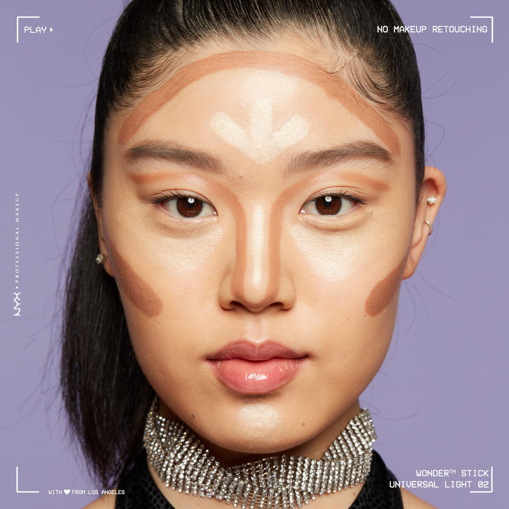 NYX Wonder Stick contour-shading on jawline for defined sculpt.