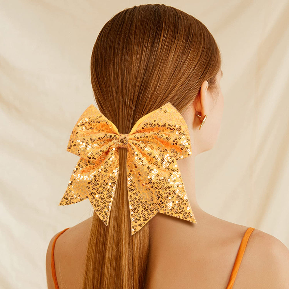 Oaooleer teen girl cheer bow on head demonstrates secure elastic fit for active cheer.