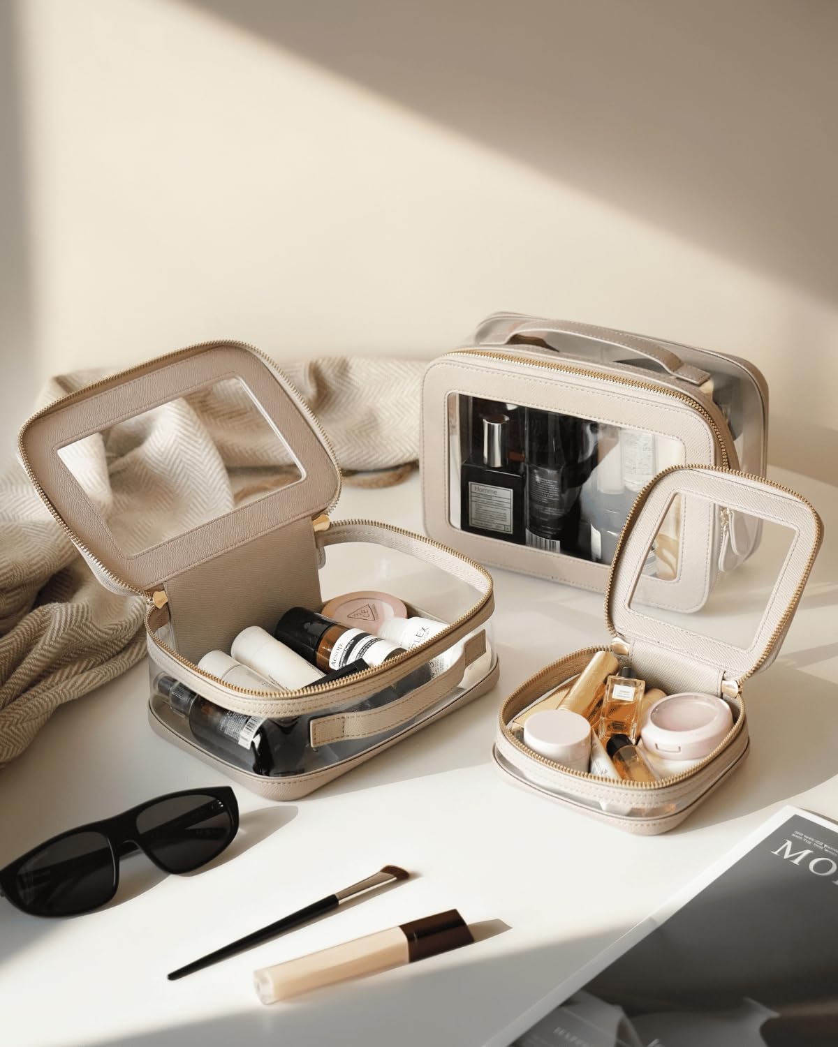Oaque Clear Cosmetic Bag Stone Small keeps travel skincare neatly separated and accessible.