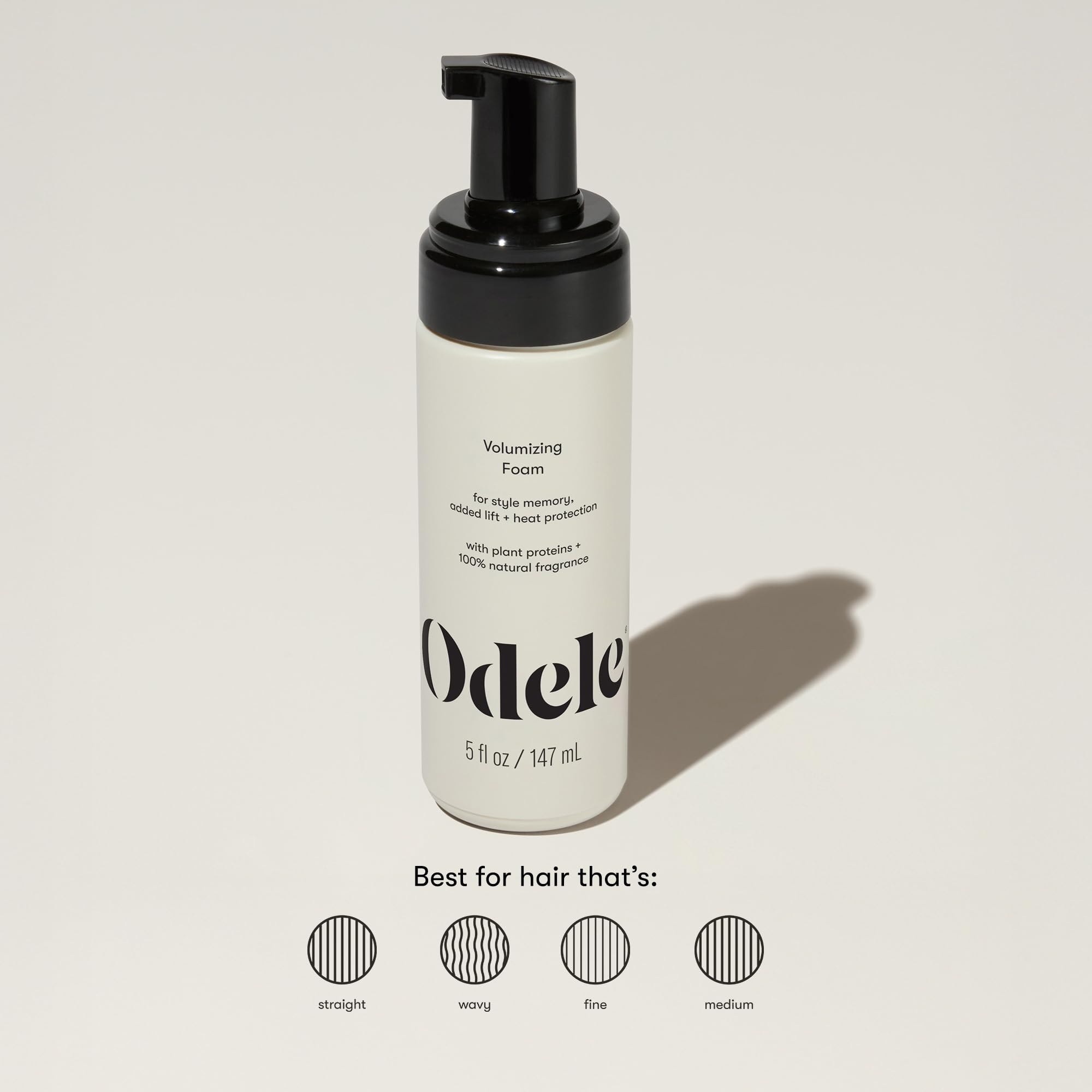 Odele Application Hands applying foam for even distribution and lift.