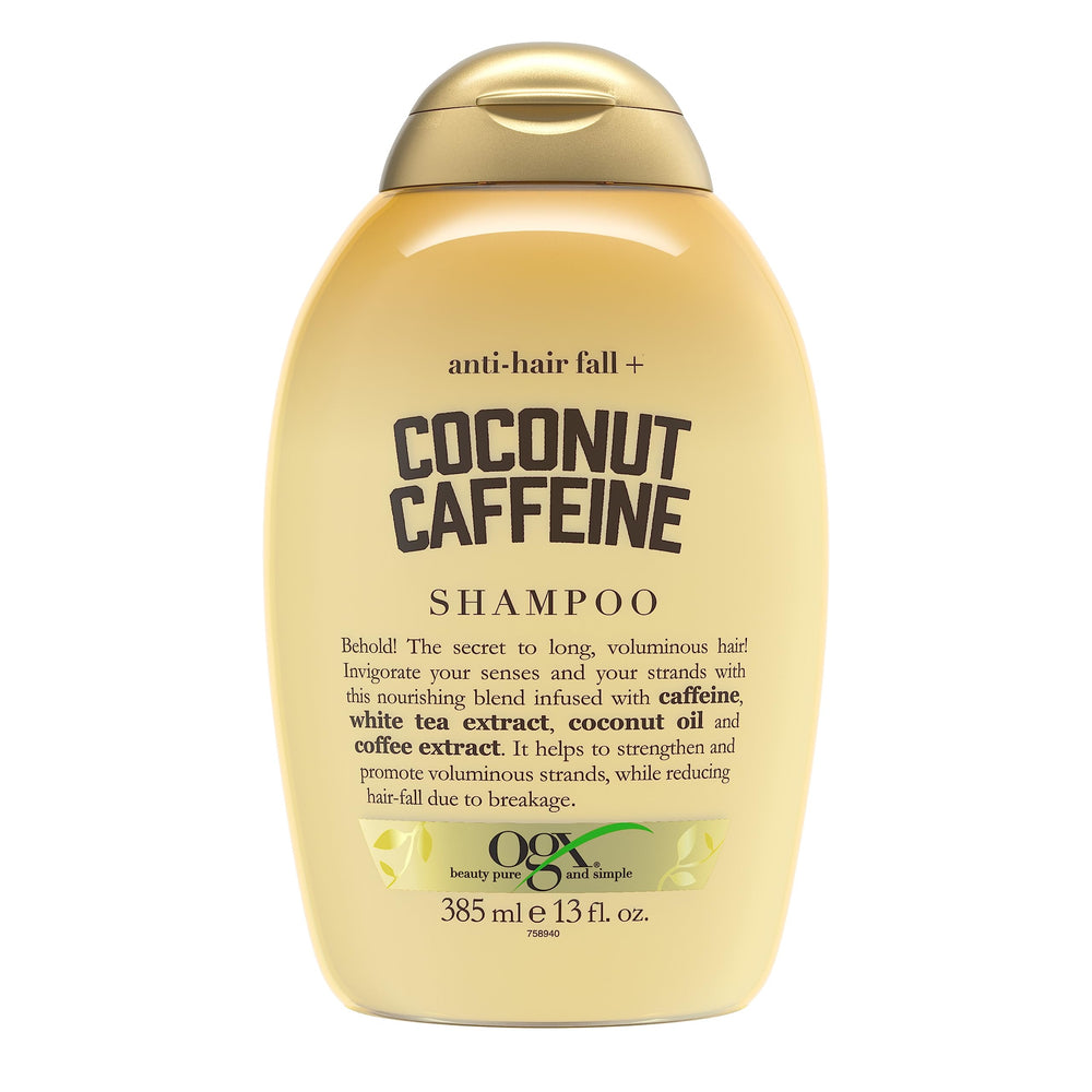 OGX Anti-Hair Fall Coconut Caffeine shampoo bottle front promotes fuller-looking hair.