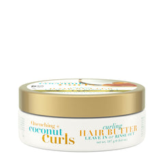 OGX Quenching Coconut Curls Butter bottle pour for detangling and curl definition.