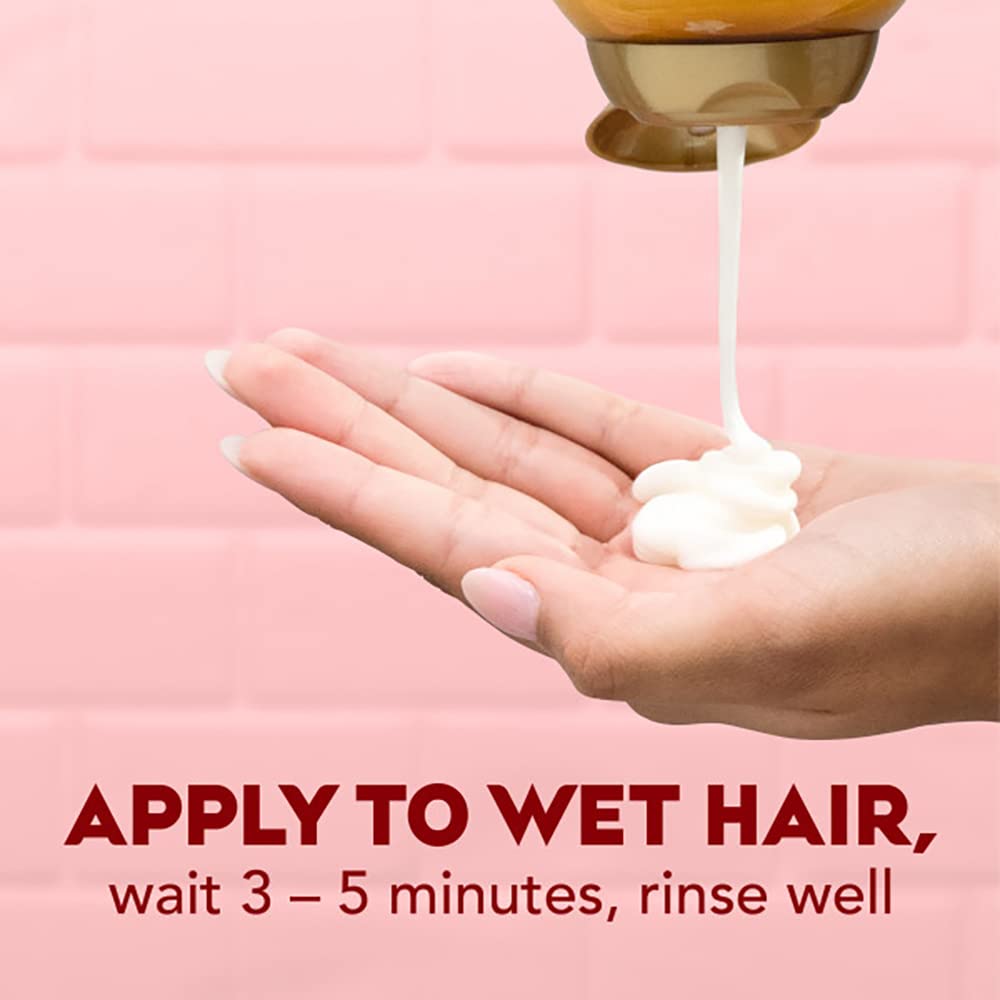 OGX wet hair with conditioner application demonstrating ease of use
