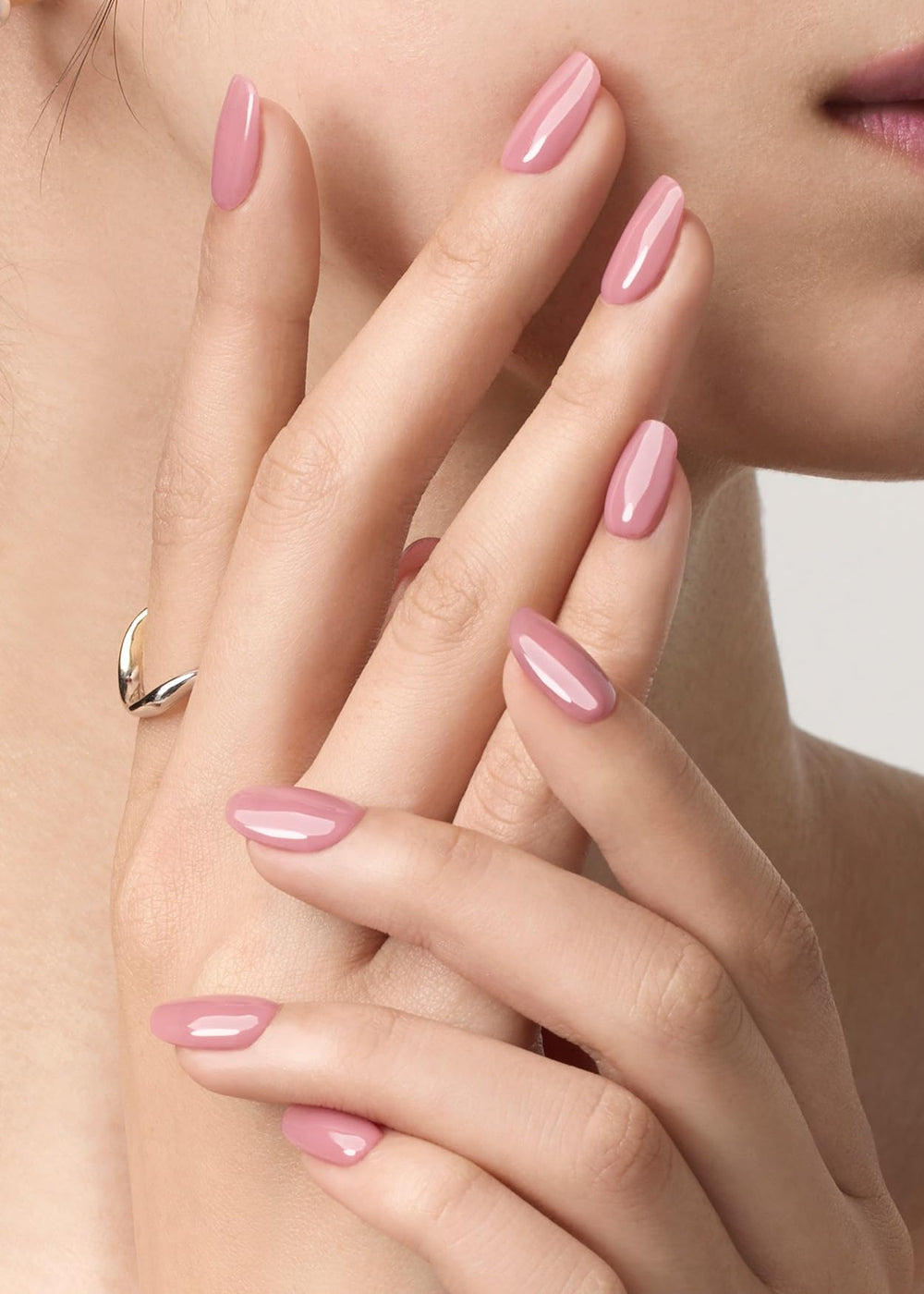 ohhora semi cured gel nail strips n bare plum applying on nail demonstrates easy, mess-free application